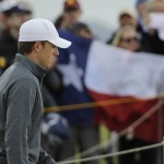 
              United States’ Jordan Spieth walks past a spectator holding the flag of Texas on the 13th hole during the first round of the British Open Golf Championship at the Old Course, St. Andrews, Scotland, Thursday, July 16, 2015. (AP Photo/David J. Phillip)
            