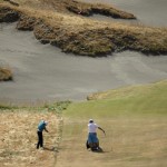 
              Martin Kaymer, left, of Germany, hits from rough on the fifth hole during a practice round for the U.S. Open golf tournament at Chambers Bay on Tuesday, June 16, 2015 in University Place, Wash. (AP Photo/Charlie Riedel)
            