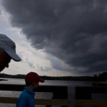 
              The crowd heads for shelter to avoid the rain during a temporary delay of the final round of the Barbasol Championship golf tournament Sunday, July 19, 2015, in Opelika, Ala. (AP Photo/Brynn Anderson)
            