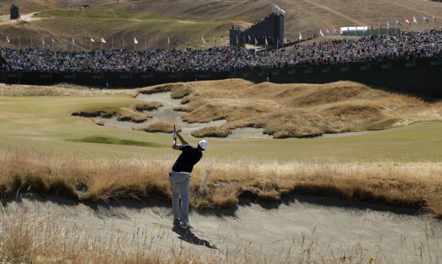 Jordan Spieth hits out of a bunker on the 18th hole during the second round of the U.S. Open golf t...