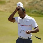 
              Tiger Woods removes his hat after his  second round in the U.S. Open golf tournament at Chambers Bay on Friday, June 19, 2015 in University Place, Wash. (AP Photo/Ted S. Warren)
            