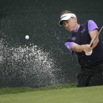 
              Ian Poulter hits from the sand on the ninth hole during the second round of the Colonial golf tournament, Friday, May 22, 2015, in Fort Worth, Texas. (AP Photo/LM Otero)
            