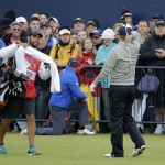 
              United States’ Jordan Spieth, right, reacts after playing his second shot on the 18th the final round at the British Open Golf Championship at the Old Course, St. Andrews, Scotland, Monday, July 20, 2015.  (AP Photo/David J. Phillip)
            
