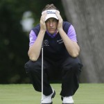 
              Ian Poulter looks at his putt line before setting up for his shot on the seventh hole during the second round of the Colonial golf tournament, Friday, May 22, 2015, in Fort Worth, Texas. (AP Photo/LM Otero)
            