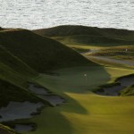 
              In this April 29, 2015, photo, the 10th hole of the Chambers Bay golf course is shown at sunset in University Place, Wash. Next week the course, which opened in 2007, will become the youngest golf course to host the U.S. Open since Hazeltine in 1970. (AP Photo/Ted S. Warren)
            