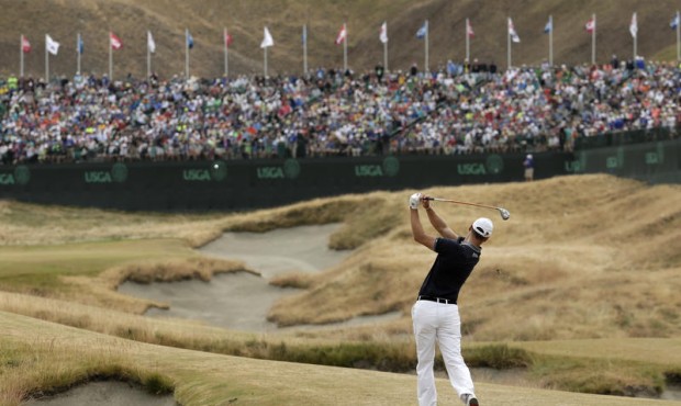 Martin Kaymer, of Germany, hits from the fairway on the 18th hole during the first round of the U.S...