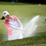 
              Inbee Park, of South Korea, hits out of a sand trap on the first green during the third round of the KPMG Women's PGA golf championship at Westchester Country Club on Saturday, June 13, 2015, in Harrison, N.Y. (AP Photo/Kathy Kmonicek)
            