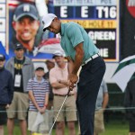 
              Tiger Woods watches his putt on the 11th green during the first round of the Greenbrier Classic golf tournament at the Greenbrier Resort in White Sulphur Springs, W.Va., Thursday, July 2, 2015.  (AP Photo/Steve Helber)
            