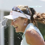 
              Lexi Thompson is doused with water after winning the Meijer LPGA Classic golf tournament Sunday, July 26, 2015, in Belmont, Mich. (AP Photo/Carlos Osorio)
            