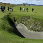 
              In this Sept. 30, 2014, photo, reporters and photographers stand near the deep pot bunker on the 18th fairway at Chambers Bay, the host course for the 2015 U.S. Open golf tournament, in University Place, Wash. (AP Photo/Ted S. Warren)
            