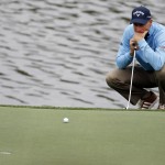 
              Jim Furyk lines up a putt on the 14th hole during the first round of the Wells Fargo Championship golf tournament at Quail Hollow Club in Charlotte, N.C., Thursday, May 14, 2015. (AP Photo/Bob Leverone)
            