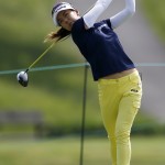 
              Jenny Shin, of South Korea, tees off the ninth hole during the first round of the KPMG Women's PGA golf championship at Westchester Country Club, Thursday, June 11, 2015, in Harrison, N.Y. (AP Photo/Julio Cortez)
            
