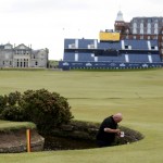 
              Greenkeepers paint the water hazard markers on the 18th hole at the Old Course, St Andrews, Scotland, Sunday, June 12, 2015. The 2015 Open Golf Championship that is due to take place at St. Andrews July 16-19.  (AP Photo/Peter Morrison)
            