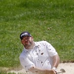 
              Jason Gore hits out of a sand trap on the 18th hole during the second round of the Travelers Championship golf tournament, Friday, June 26, 2015, in Cromwell, Conn. (AP Photo/Stew Milne)
            