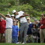 
              Tiger Woods hits on the 13th hole during the first round of the Memorial golf tournament  Thursday, June 4, 2015, in Dublin, Ohio. (AP Photo/Darron Cummings)
            