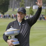 
              FILE - In this May 3, 2015, file photo, Rory McIlroy, of Northern Ireland, poses with his trophy on the 16th green of TPC Harding Park after winning the Match Play Championship golf tournament in San Francisco. (AP Photo/Eric Risberg)
            