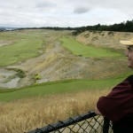 
              FILE - In this June 21, 2007, file photo, golf course designer Robert Trent Jones Jr. poses for a photo overlooking the Chambers Bay golf course in University Place, Wash., a few days before the course opened to the public. Later in June 2015, the course will become the youngest golf course to host the U.S. Open since Hazeltine in 1970. (AP Photo/Ted S. Warren, file)
            