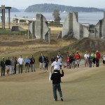 
              FILE - In this Aug. 28, 2010, file photo, David Chung reacts to sinking a putt during the U.S. Amateur golf tournament at Chambers Bay in University Place, Wash. In the background are concrete pilings and other remnants from the site's history a decade ago as an old sand and gravel pit. The course, which opened in 2007, will become the youngest golf course to host the U.S. Open since Hazeltine in 1970 when the tournament takes place later this month. (AP Photo/Ted S. Warren, file)
            