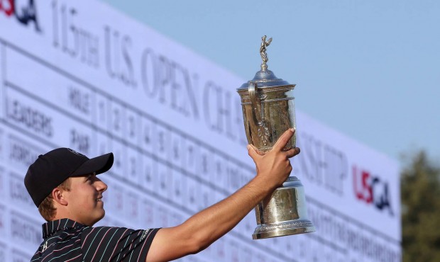 FILE – In this Sunday, June 21, 2015, file photo, Jordan Spieth poses with the trophy after w...