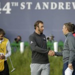 
              United States’ Jordan Spieth, right, shakes hands with United States’ Dustin Johnson after finishing their round on the 18th green during the second round of the British Open Golf Championship at the Old Course, St. Andrews, Scotland, Saturday, July 18, 2015. (AP Photo/David J. Phillip)
            