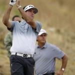 
              Bubba Watson, left, watches his tee shot as Phil Mickelson watches on the fifth hole during the first round of the U.S. Open golf tournament at Chambers Bay on Thursday, June 18, 2015 in University Place, Wash. (AP Photo/Ted S. Warren)
            