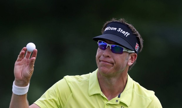 Ricky Barnes waves to fans after finishing tied for first during the third round of the Barbasol Ch...