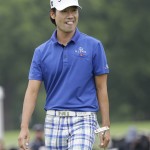 
              Kevin Na carries a putter after sinking his shot on the ninth hole during the second round of the Colonial golf tournament, Friday, May 22, 2015, in Fort Worth, Texas. (AP Photo/LM Otero)
            