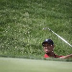 
              Tiger Woods hits out of the bunker on the 17th hole during the final round of the Memorial golf tournament Sunday, June 7, 2015, in Dublin, Ohio. (AP Photo/Darron Cummings)
            