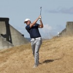 
              Jordan Spieth hits out of the tall fescue grass on the 18th hole during the second round of the U.S. Open golf tournament at Chambers Bay on Friday, June 19, 2015 in University Place, Wash. (AP Photo/Charlie Riedel)
            