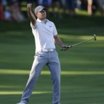 
              Jordan Spieth celebrates his birdie on the 18th green during the third round of the John Deere Classic golf tournament Saturday, July 11, 2015, in Silvis, Ill. (AP Photo/Charles Rex Arbogast)
            