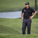
              Phil Mickelson looks over his third shot on the 15th hole during the second round of the Wells Fargo Championship golf tournament at Quail Hollow Club in Charlotte, N.C., Friday, May 15, 2015. (AP Photo/Chuck Burton)
            