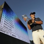 
              Jordan Spieth holds up the trophy after winning the U.S. Open golf tournament at Chambers Bay on Sunday, June 21, 2015 in University Place, Wash. (AP Photo/Charlie Riedel)
            