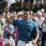 
              Rory McIlroy, of Northern Ireland, celebrates after winning the Wells Fargo Championship golf tournament at Quail Hollow Club in Charlotte, N.C., Sunday, May 17, 2015. (AP Photo/Chuck Burton)
            