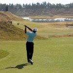 
              Tiger Woods watches his tee shot on the 18th hole during a practice round for the U.S. Open golf tournament at Chambers Bay, Monday, June 15, 2015, in University Place, Wash. (AP Photo/Ted S. Warren)
            
