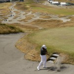 
              Shane Lowry, of Ireland, hits out of the bunker on the fourth hole during a practice round for the U.S. Open golf tournament at Chambers Bay on Monday, June 15, 2015 in University Place, Wash. (AP Photo/Ted S. Warren)
            