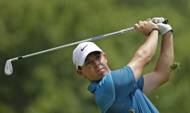 Rory McIlroy, of Northern Ireland, watches his tee shot on the second hole during the final round o...