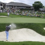 
              Bo Van Pelt hits out of the bunker on the 18th hole during the first round of the Memorial golf tournament, Thursday, June 4, 2015, in Dublin, Ohio. (AP Photo/Darron Cummings)
            