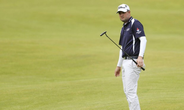 Australia’s Marc Leishman watches his putt on the 18th during the third round at the British ...
