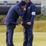 
              Officials observe a golf ball to see if it was moving in the wind on the 11th green during the second round of the British Open Golf Championship at the Old Course, St. Andrews, Scotland, Saturday, July 18, 2015. Play was suspended on Saturday as high winds caused players golf balls to move on some greens in the high winds. (AP Photo/Alastair Grant)
            
