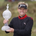 
              Denmark's Soren Kjeldsen holds the Irish Open Golf trophy after he won on the first play off hole at Royal County Down, Newcastle, Northern Ireland, Sunday, May 31, 2015.  (AP Photo/Peter Morrison)
            