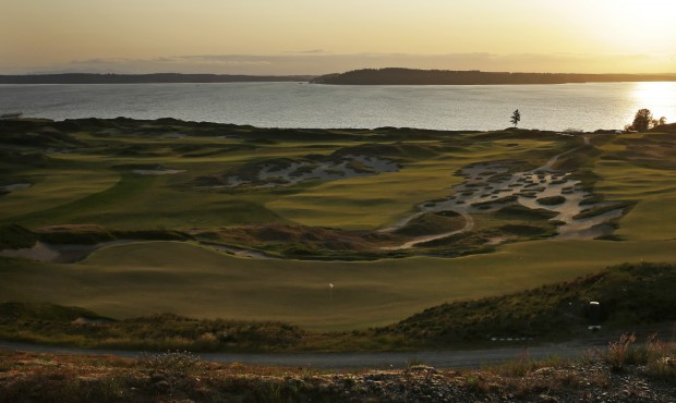 In this April 29, 2015, photo, Chambers Bay golf course is shown at sunset in University Place, Was...