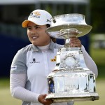 
              Inbee Park, of South Korea, holds the PGA Women's Championship Trophy after winning the KPMG Women's PGA golf championship at Westchester Country Club on Sunday, June 14, 2015, in Harrison, N.Y. Park won Women's PGA Championship for the third consecutive time. (AP Photo/Kathy Kmonicek)
            