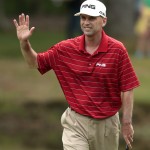 
              Kevin Sutherland waves to fans after making a birdie putt on the ninth hole during the Regions Tradition Champions Tour golf tournament at Shoal Creek Country Club, Saturday, May 16, 2015, in Birmingham, Ala. (AP Photo/Butch Dill)
            