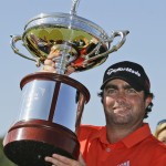 
              Steven Bowditch poses with the trophy after winning the Byron Nelson golf tournament, Sunday, May 31, 2015, in Irving, Texas. Bowditch won with a 16-under score. (AP Photo/LM Otero)
            