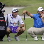 
              Brooks Koepka, right, studies the 16th green with his caddie in the second round of the St. Jude Classic golf tournament Friday, June 12, 2015, in Memphis, Tenn. (AP Photo/Mark Humphrey)
            