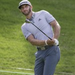 
              Dustin Johnson watches his chip shot land on the the 17th green during the third round of the Byron Nelson golf tournament, Saturday, May 30, 2015, in Irving, Texas. (AP Photo/LM Otero)
            