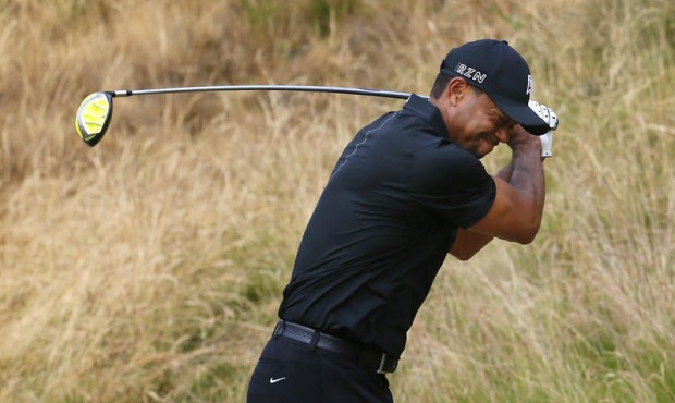 Tiger Woods reacts to his tee shot on the eighth hole during the first round of the U.S. Open golf ...