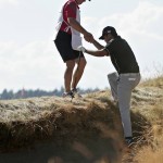 
              Jason Day, of Australia, gets a hand out of the bunker from his caddie Colin Swatton on the 10th hole during the final round of the U.S. Open golf tournament at Chambers Bay on Sunday, June 21, 2015 in University Place, Wash. (AP Photo/Charlie Riedel)
            