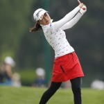 
              Sakura Yokomine, of Japan, tees off on the 10th hole during the KPMG Women's PGA golf championship at Westchester Country Club, Thursday, June 11, 2015, in Harrison, N.Y. (AP Photo/Julio Cortez)
            
