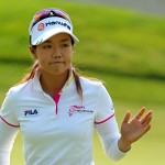 
              Jenny Shin, of South Korea, acknowledges the crowd after putting on the 11th green during the second round of the KPMG Women's PGA golf championship at Westchester Country Club, Friday, June 12, 2015, in Harrison, N.Y.  (AP Photo/Adam Hunger)
            